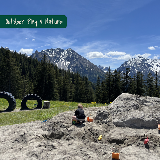 Child playing on Nature Playground on mountain in Vorarlberg, Austria. Picture of KidsTravelAdventures.